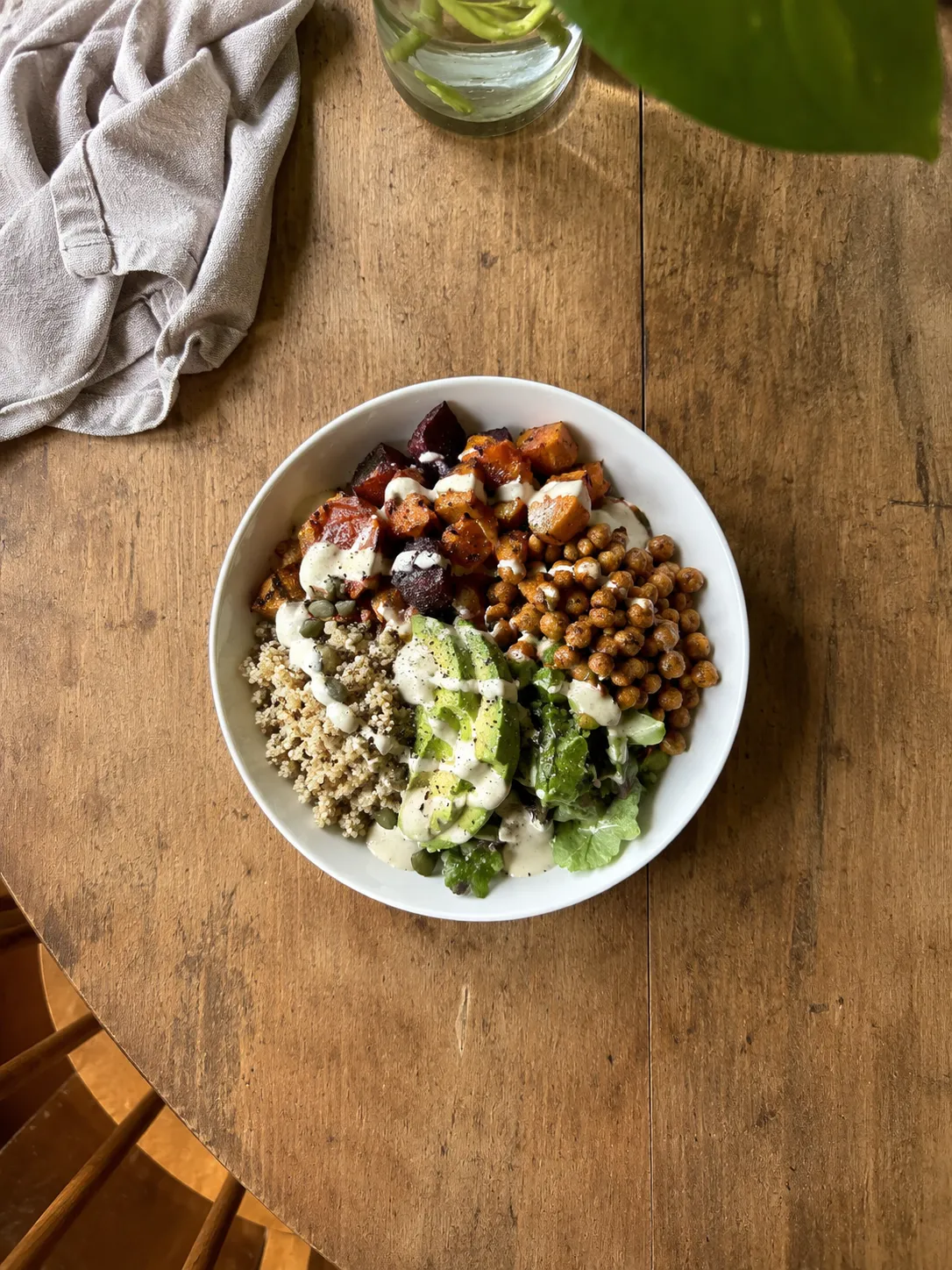 A grain bowl with vegetables and chicken
