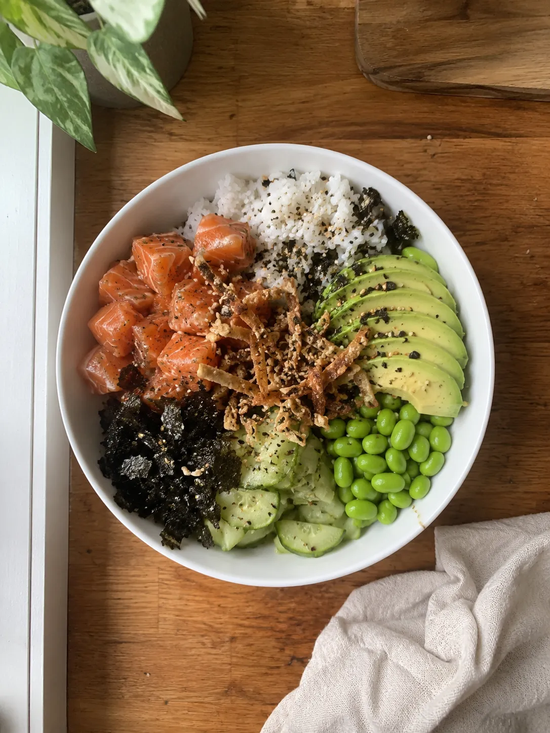 A salmon poke bowl photographed from above