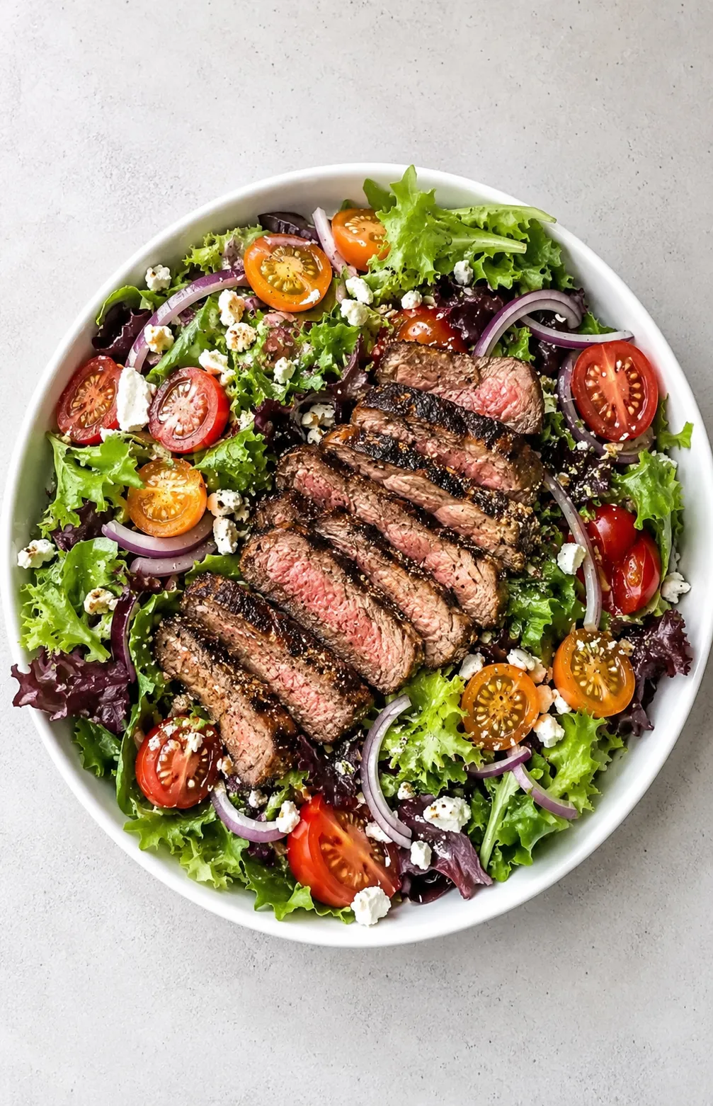 A seared steak with greens